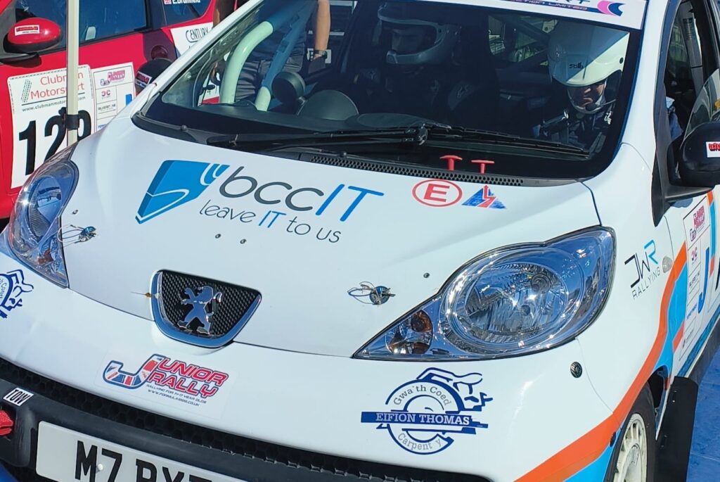 Peugeot 107 rally car driven by Ioan Thomas featuring BCC IT sponsorship livery