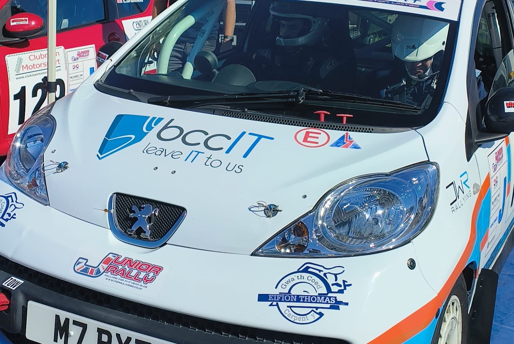 Peugeot 107 rally car driven by Ioan Thomas featuring BCC IT sponsorship livery
