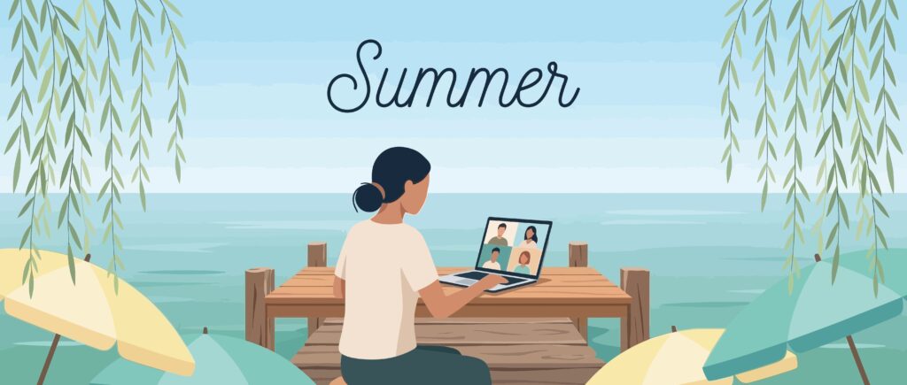 Image of a person working remotely on a beach by the sea on a laptop in the summer holiday season